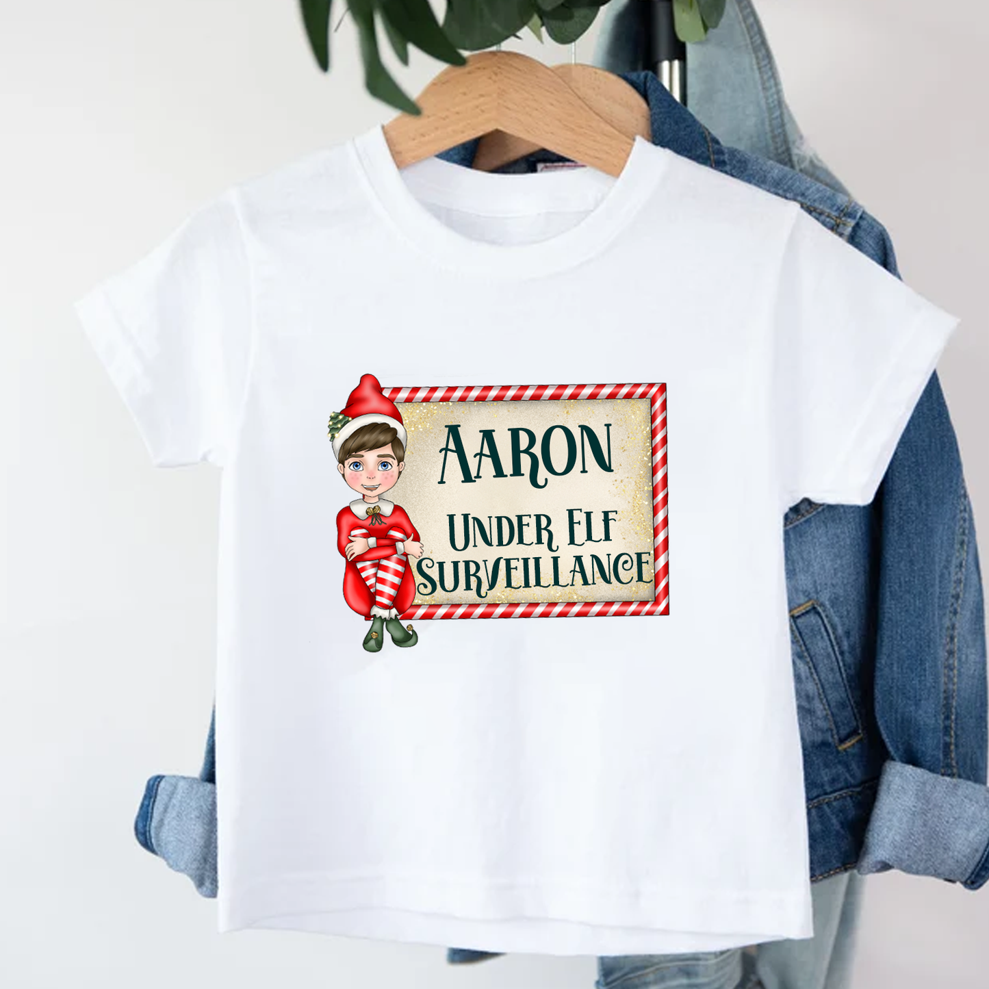 Personalised Under Elf Surveillance Cheeky Elf T-Shirt