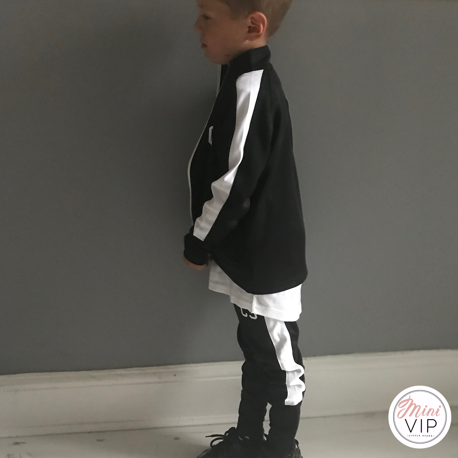 Black and white striped tracksuit sales