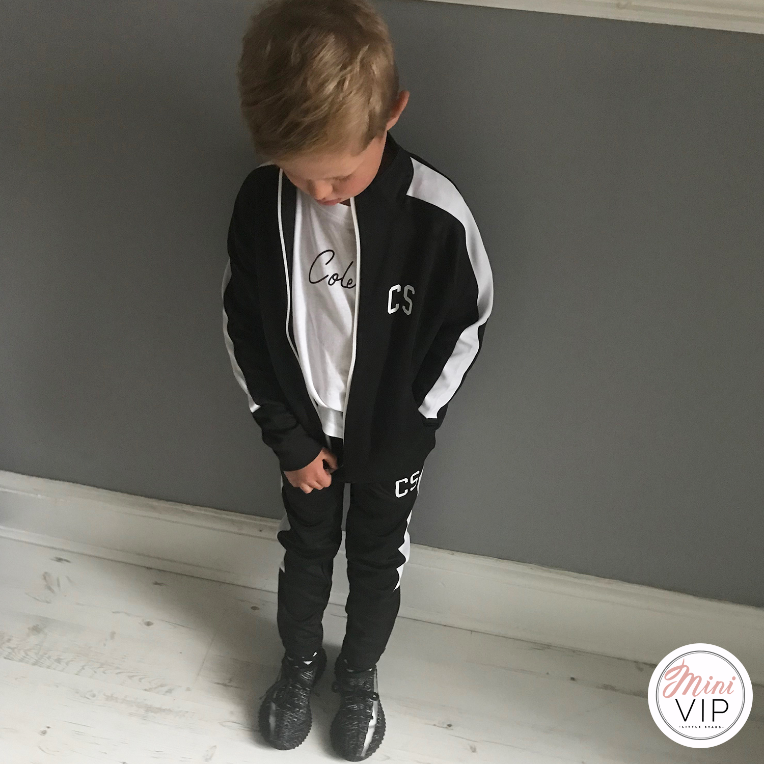 Black tracksuit shop with white stripe